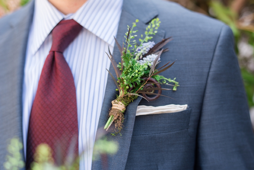 floral boutonniere on groom