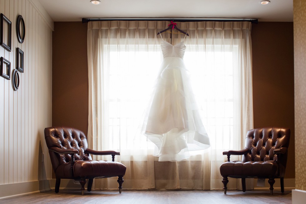 Matthew Christopher bridal dress hanging in the window at The Inn at the Chesapeake Bay Beach Club