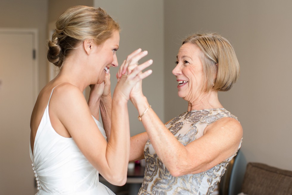 Bride and her mom getting in her wedding dress at The Inn at the Chesapeake Bay Beach Club