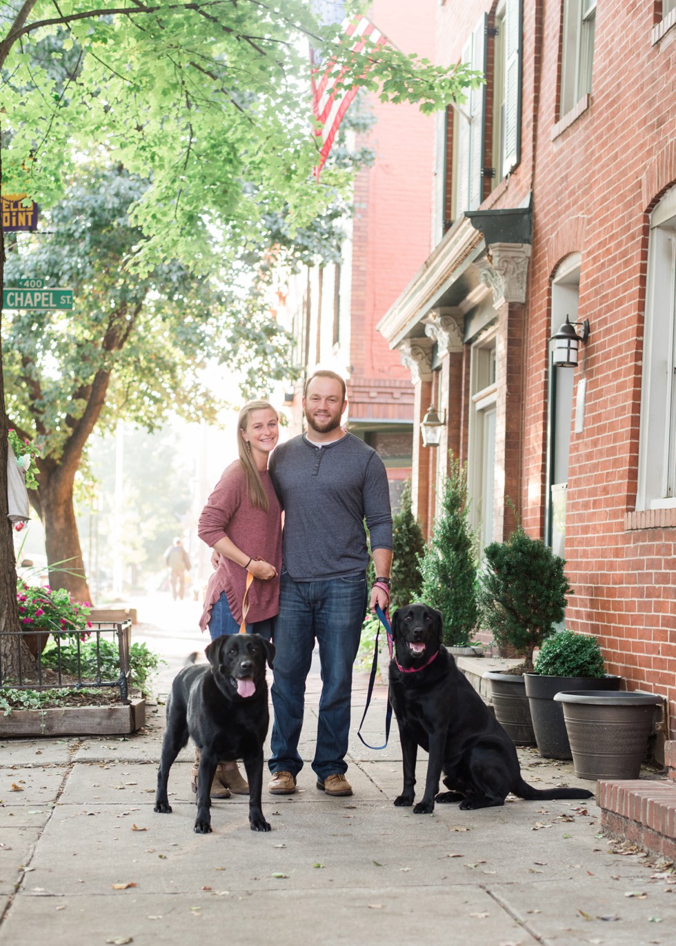 black labs in engagement photos at home