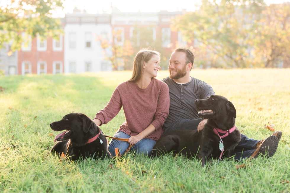 Black labs in engagement photos at Patterson Park near Fells Point