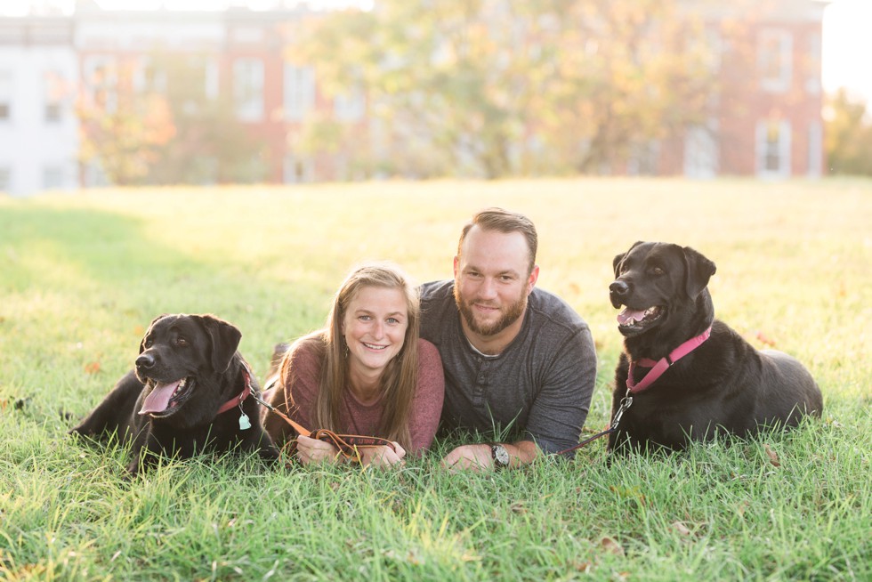 Black labs in engagement photos at Patterson Park near Fells Point