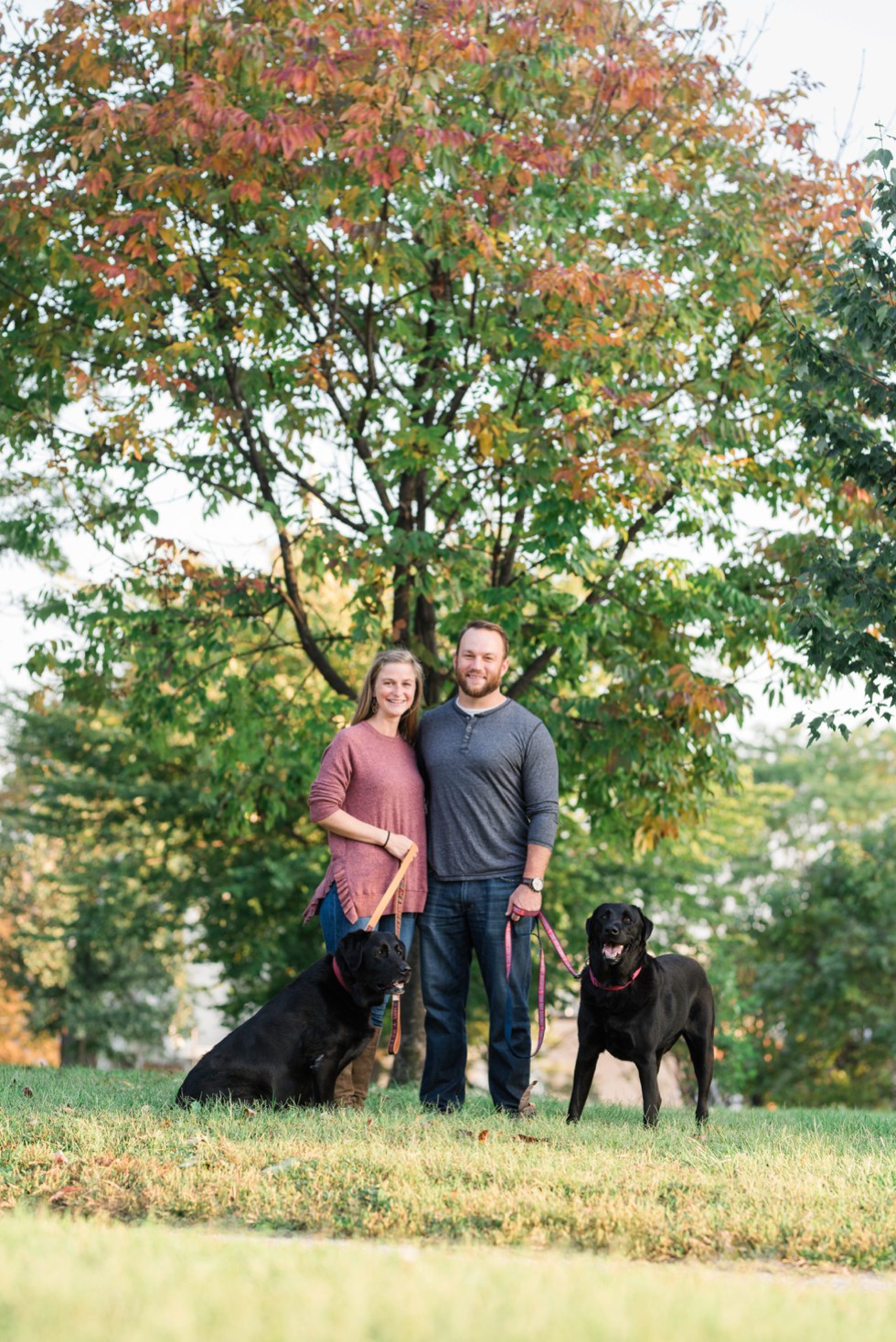 Patterson Park Pagoda Engagement photos with two black labs