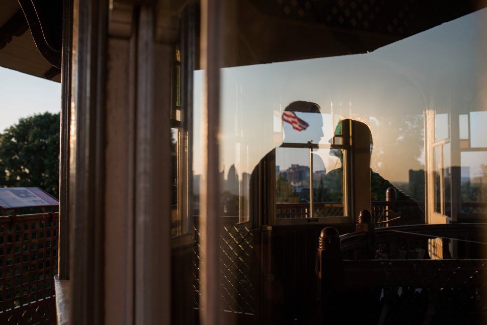 Engagement photo reflection At the top of Patterson Park Pagoda overlooking Baltimore