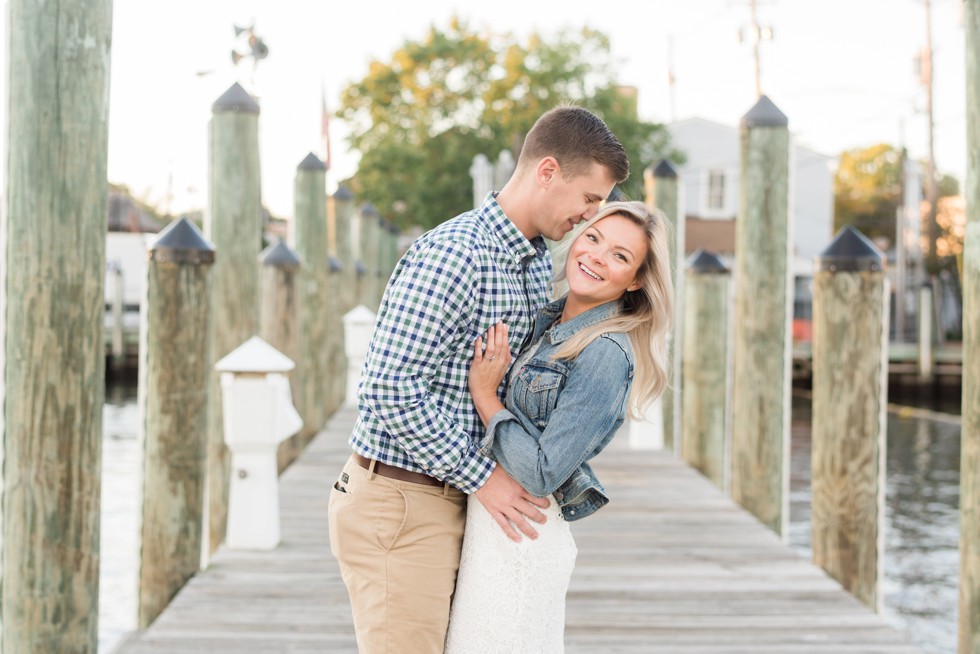 engaged couple on a pier in Annapolis