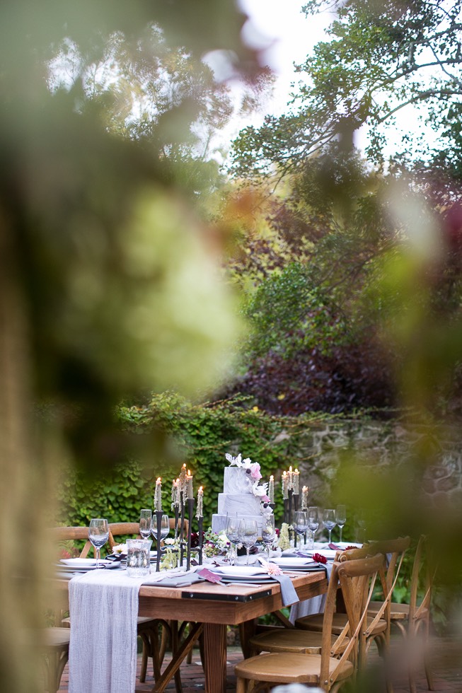 wedding cake on table with reception decor