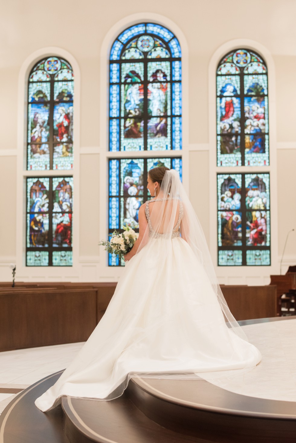 bride in front of stained glass