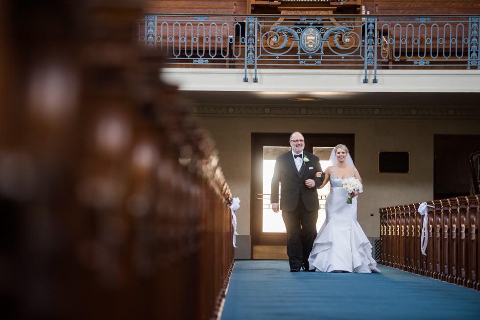 Bride and father walking the aisle US Naval Academy Chapel wedding