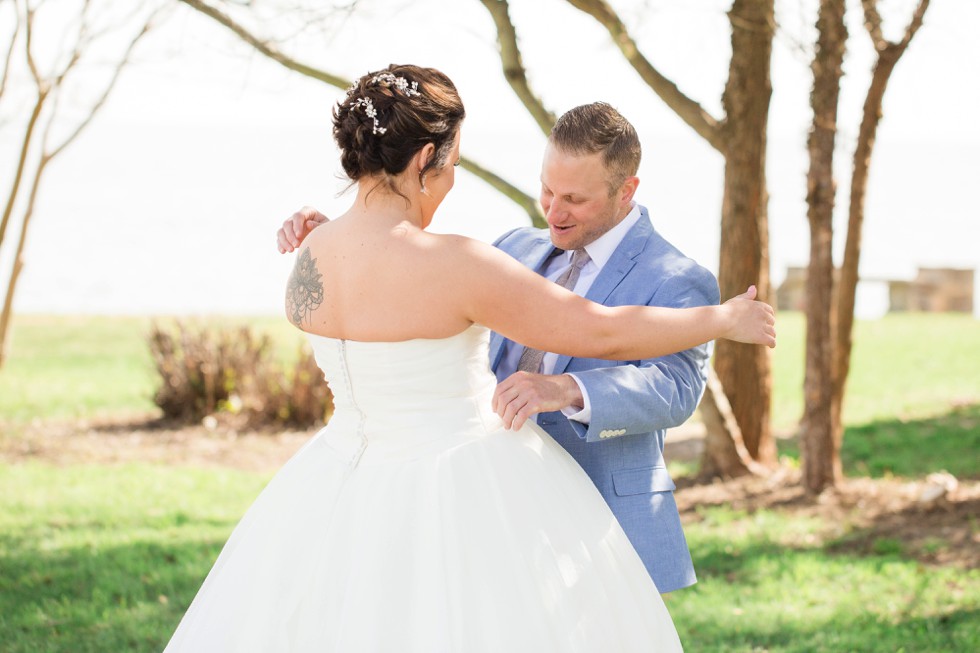 bride and groom in blue first look