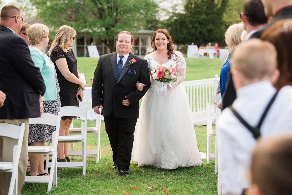 Outdoor spring wedding ceremony Kent Manor Inn