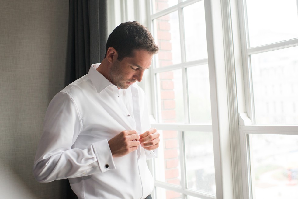 groom getting ready at Le Meridien