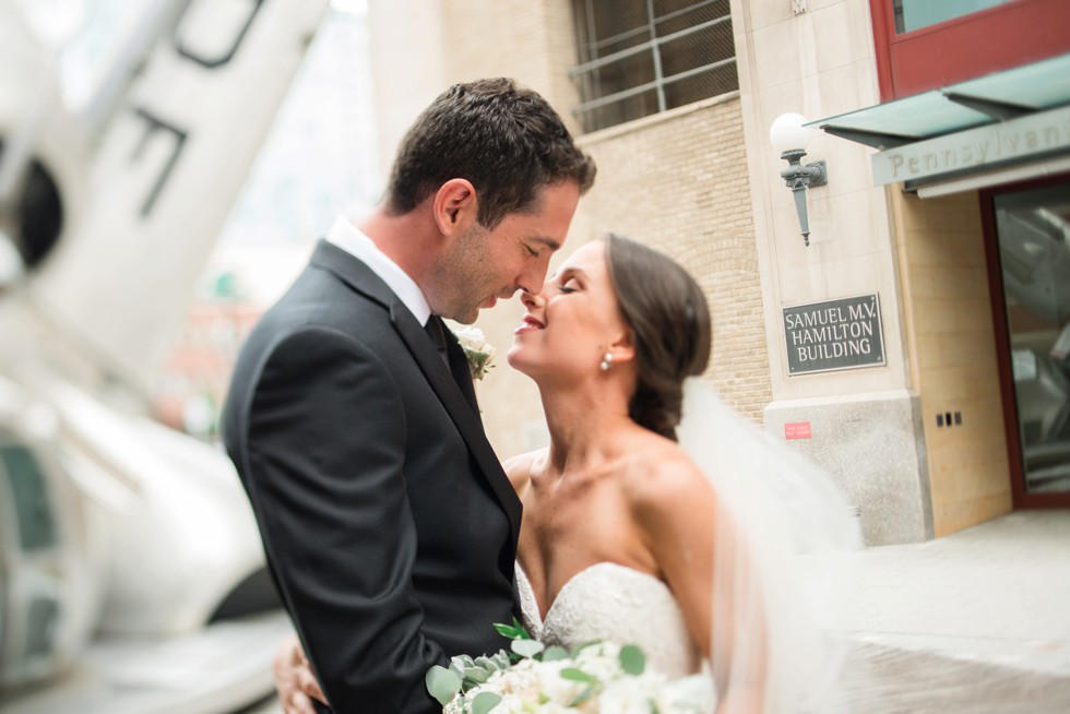 bride and groom first look at PAFA in front of plane