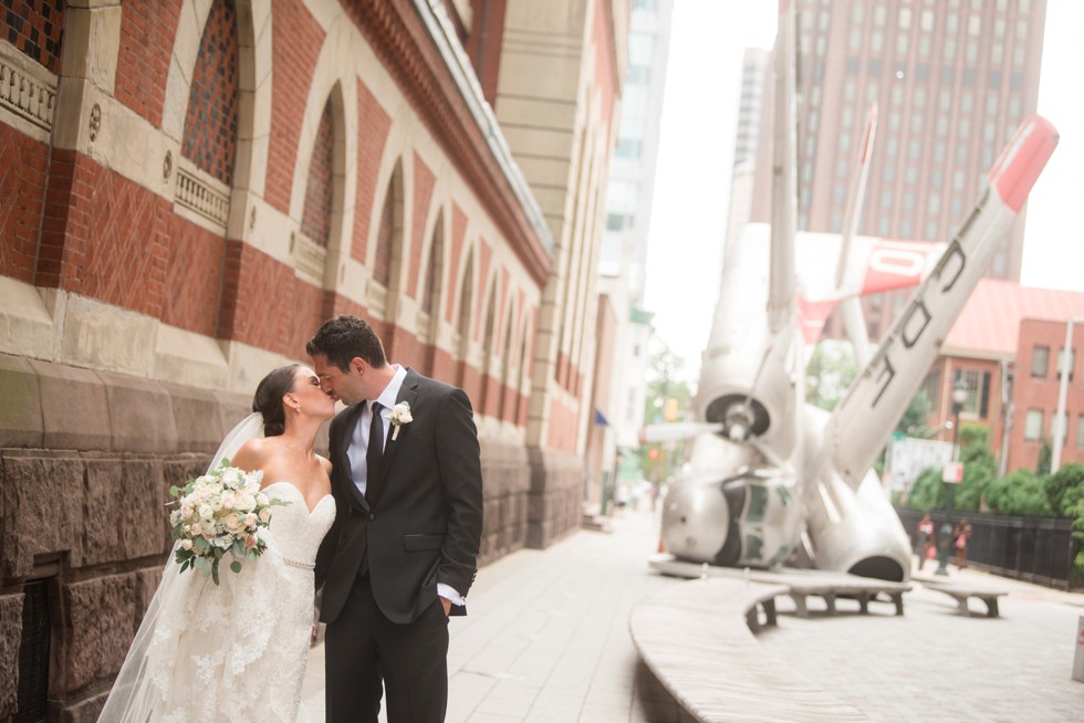 bride and groom first look at PAFA in front of plane