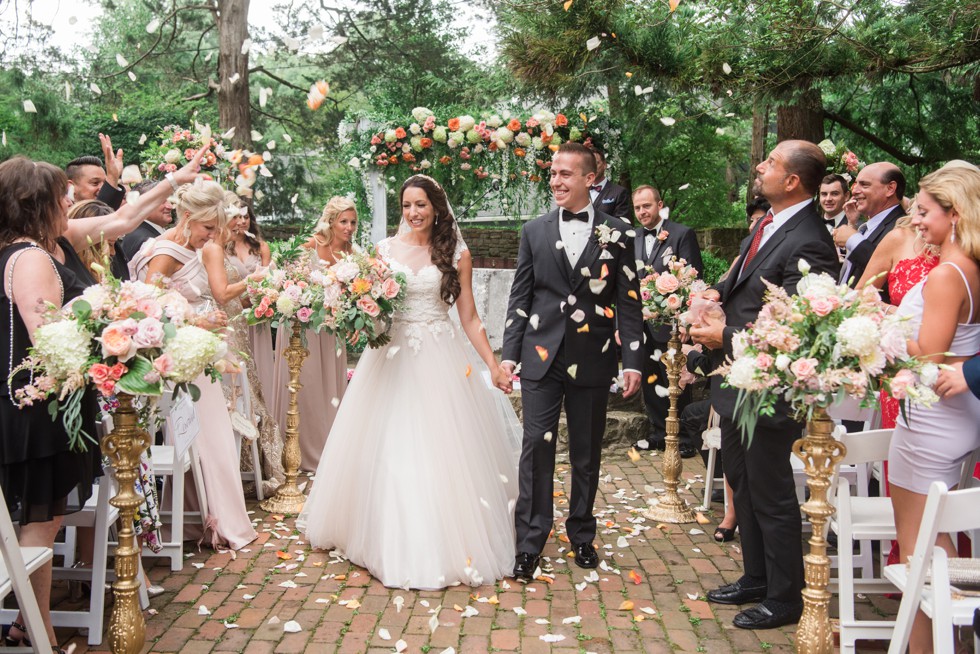 Holly Hedge estate wedding ceremony with rose petals