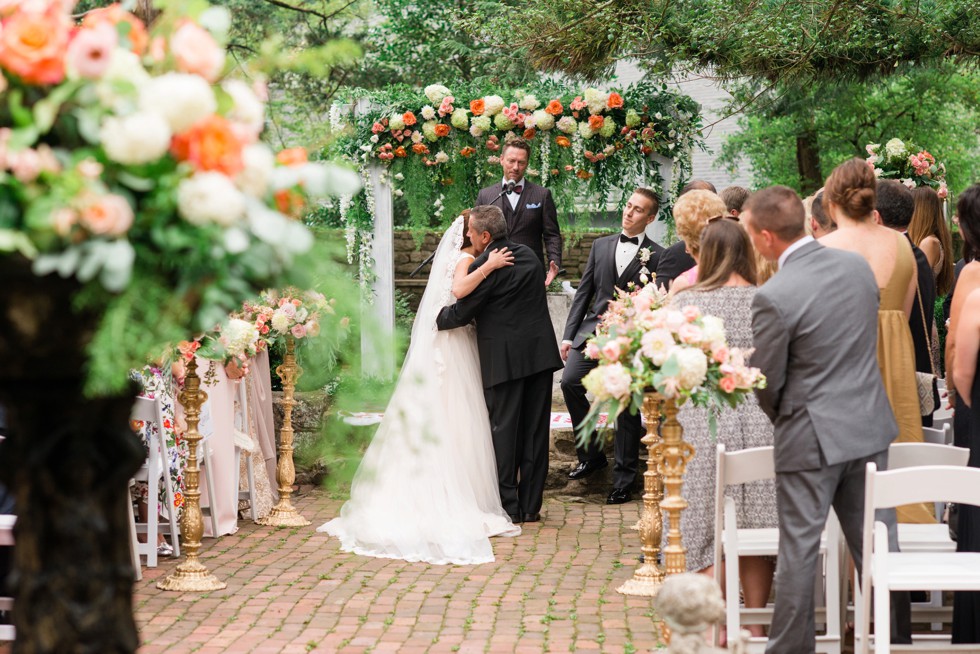 Holly Hedge estate wedding ceremony with rose petals