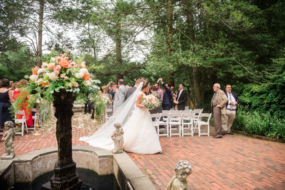 Holly Hedge estate wedding ceremony with rose petals