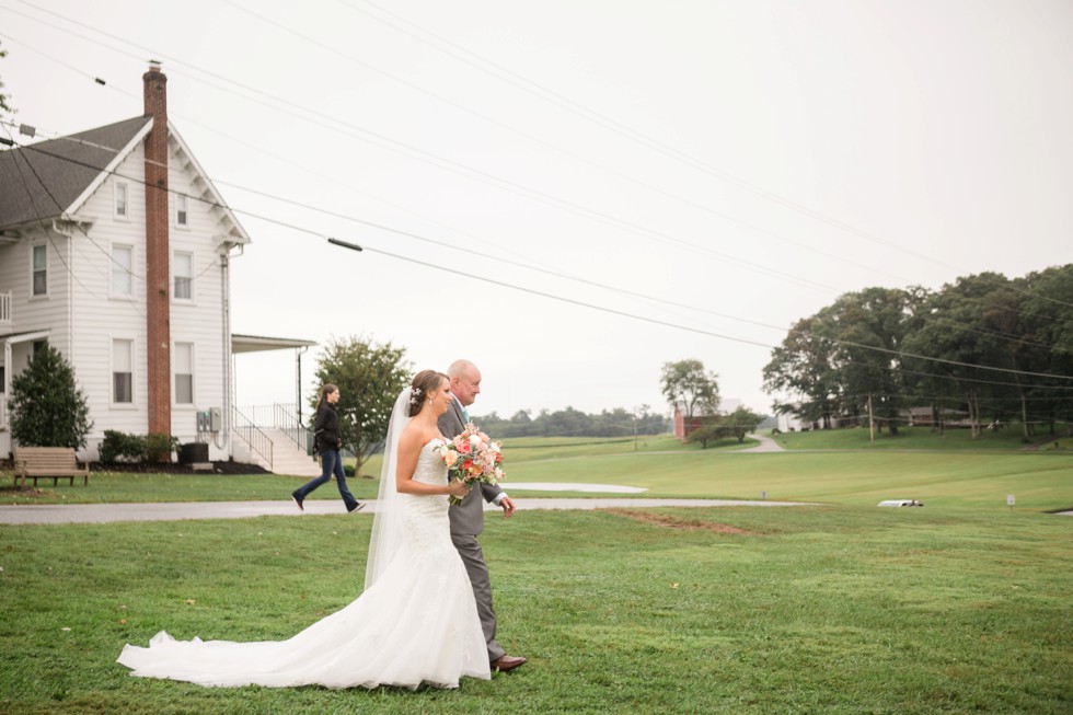 Friendly farm wedding ceremony under a tent