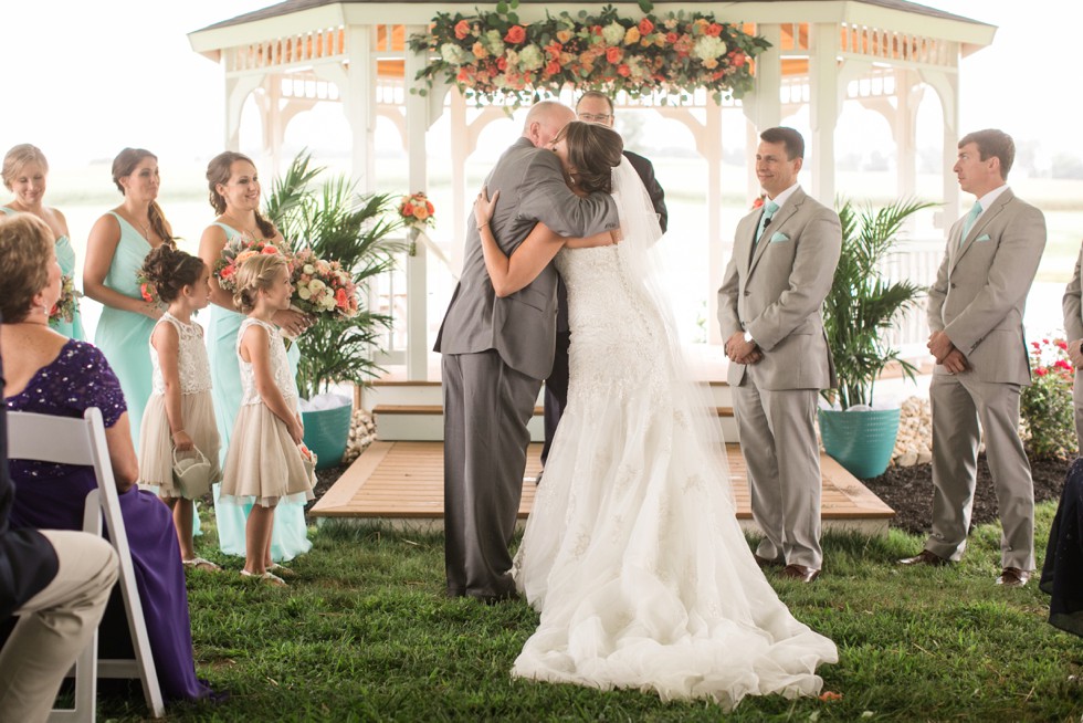 Friendly farm wedding ceremony under a tent