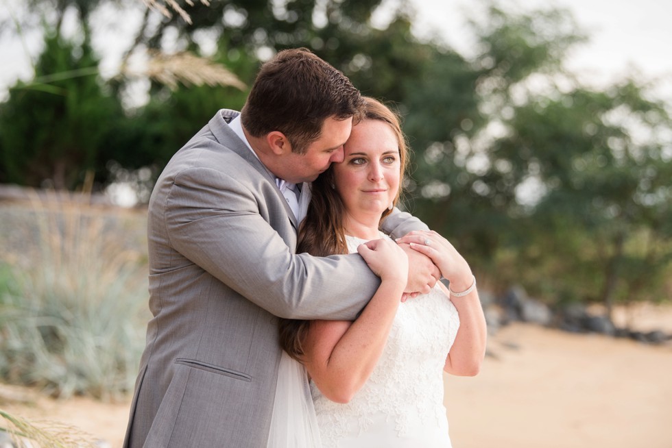 bride and groom on the beach at sunset