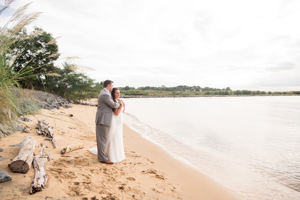 bride and groom on the beach at sunset