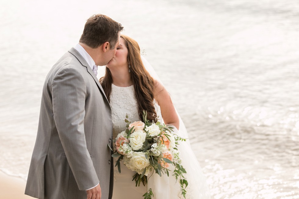 bride and groom on the beach at sunset