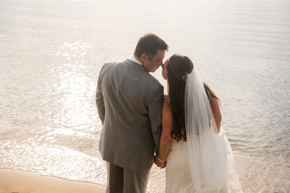 bride and groom on the beach at sunset