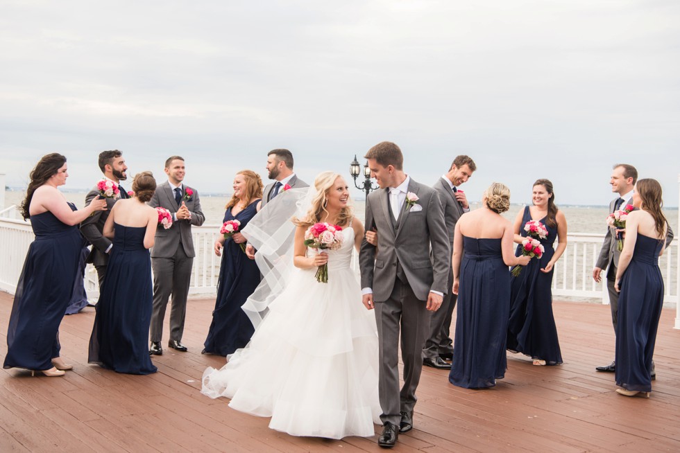 Maryland waterfront wedding couple with puppies