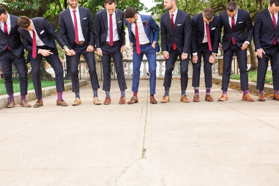 Groom and groomsmen Mount Vernon Place across from Walters Art Museum