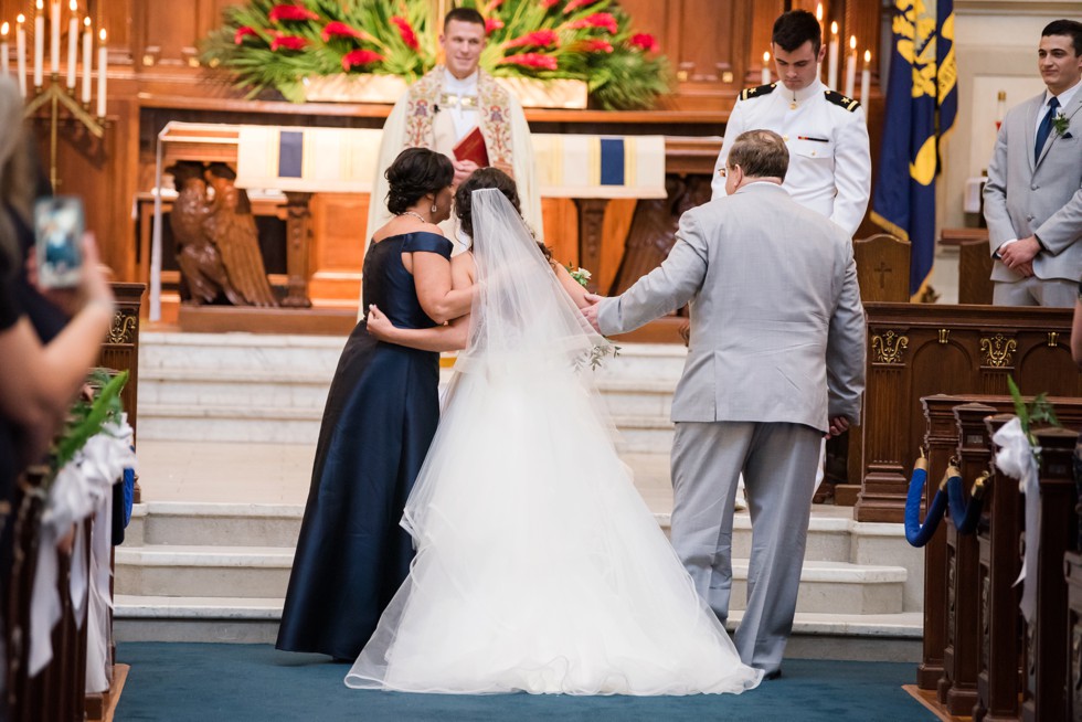 mother hugging bride in USNA Chapel