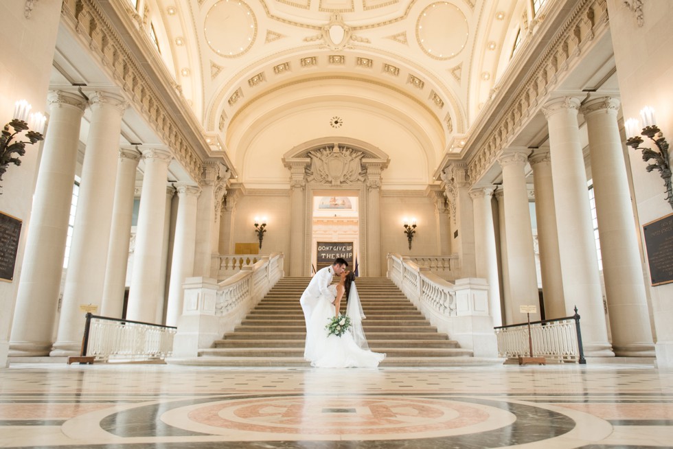 Bancroft Hall grand staircase USNA wedding couple