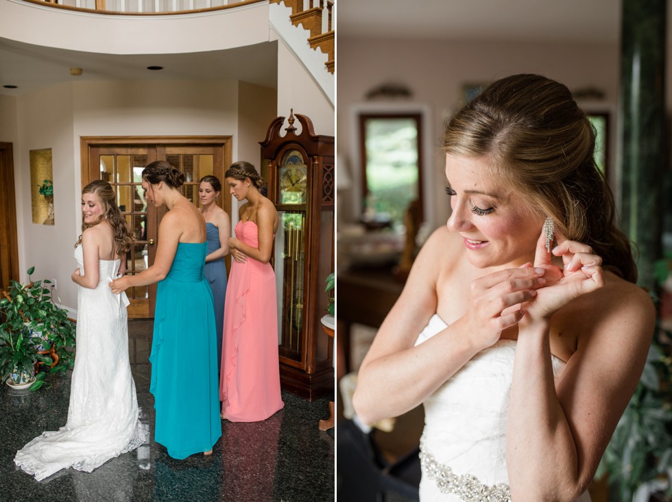 bride putting on wedding gown