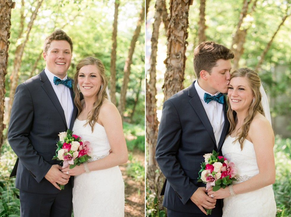 bride and groom in trees at Baltimore Royal Sonesta