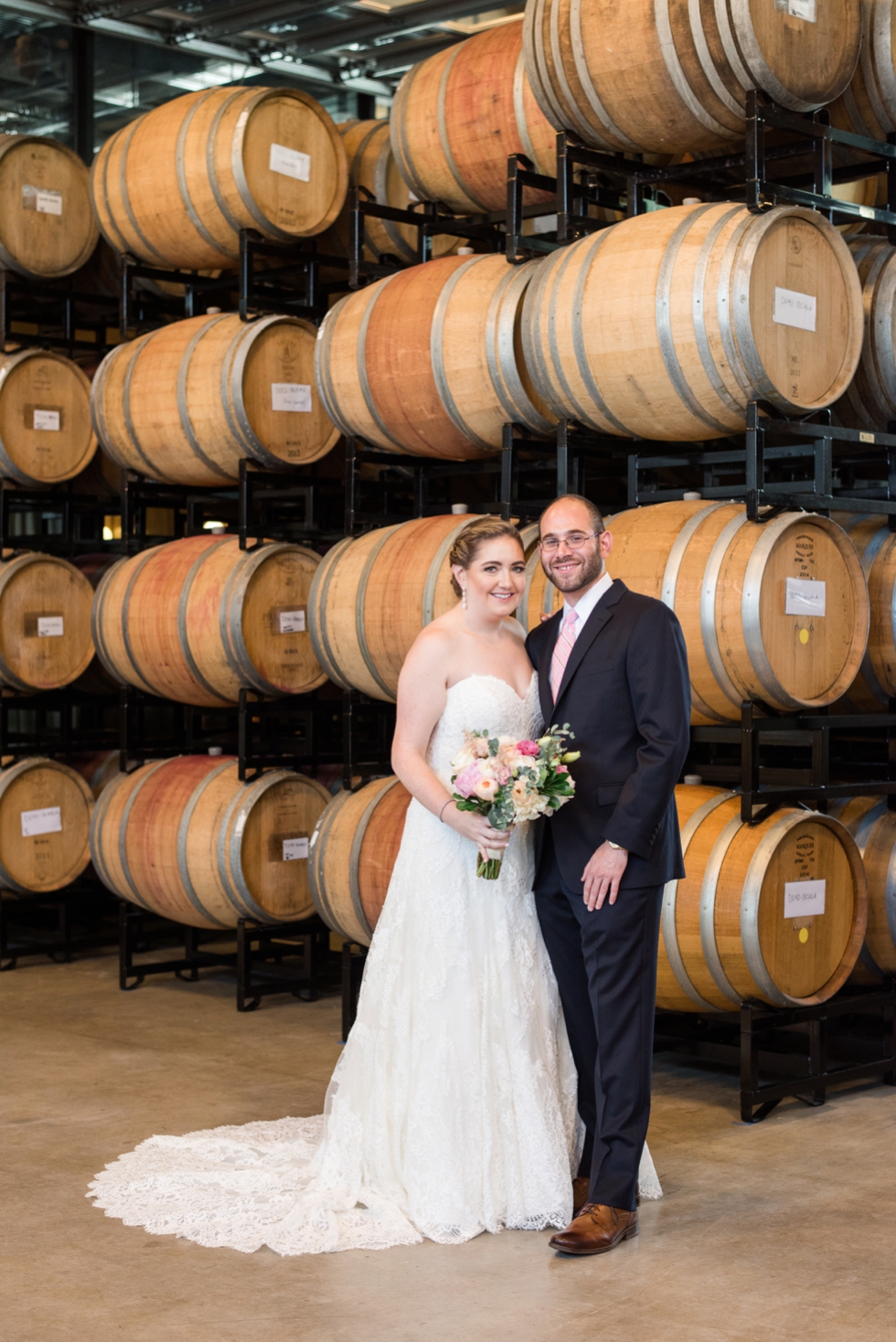 District Winery barrel room bride and groom