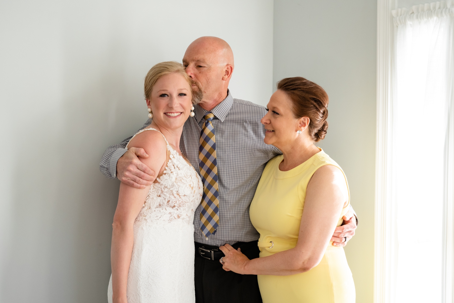 Parents and the bride getting ready