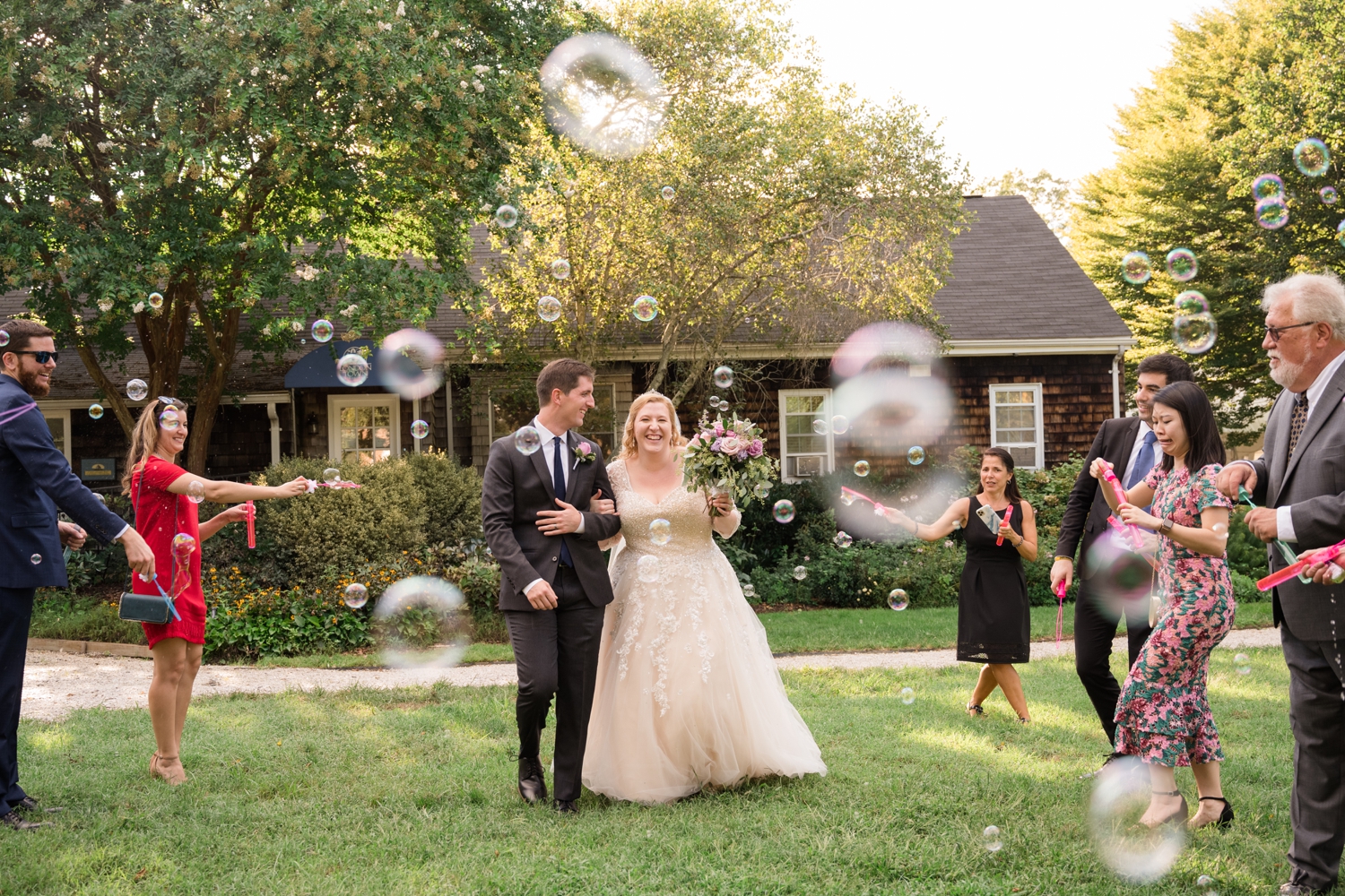 Annapolis Elopement and Micro wedding couple running through bubbles