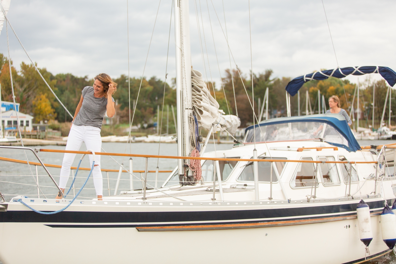 two brides in love elopement ceremony on their sailboat