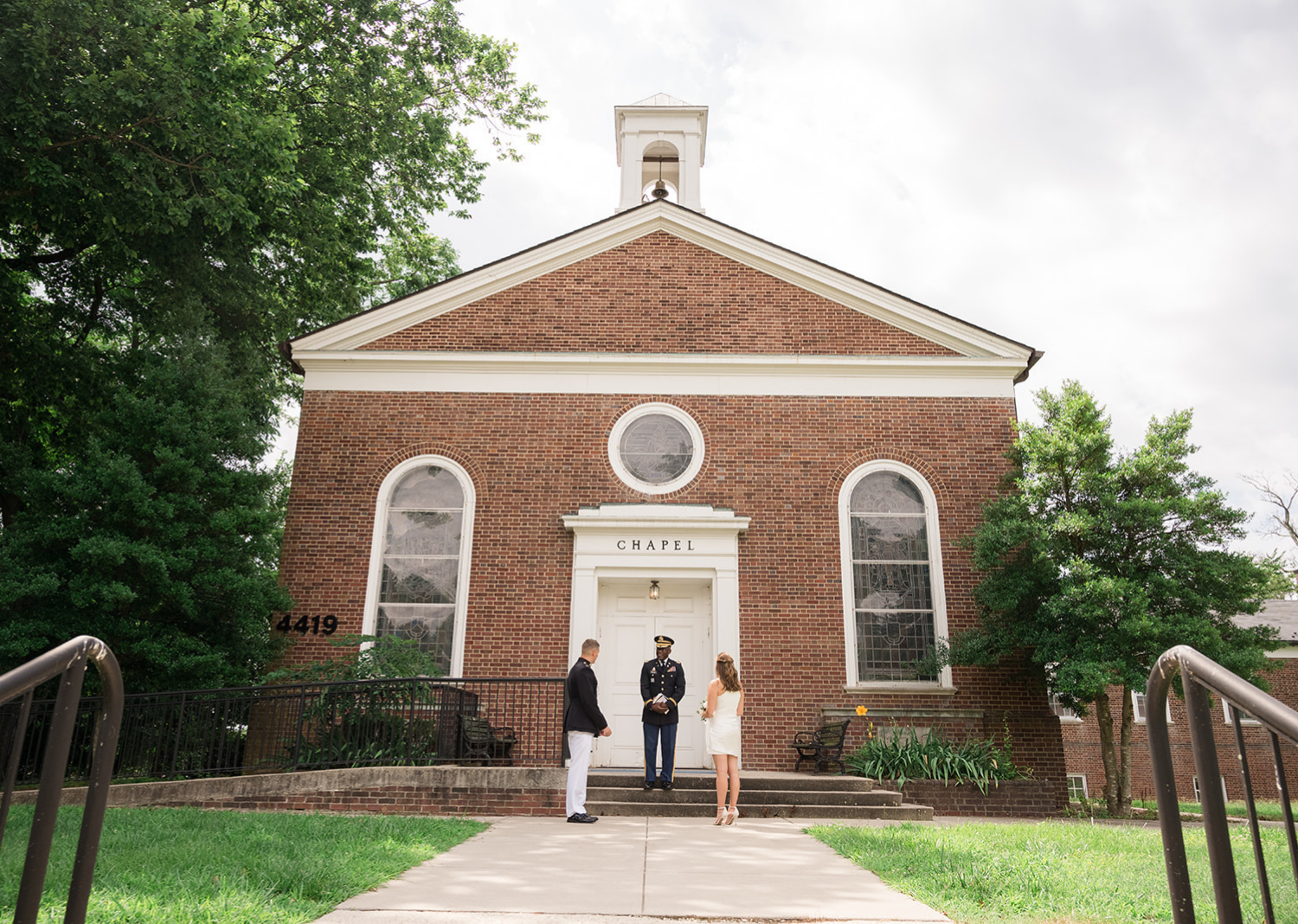 bride and groom in front of the chapel 