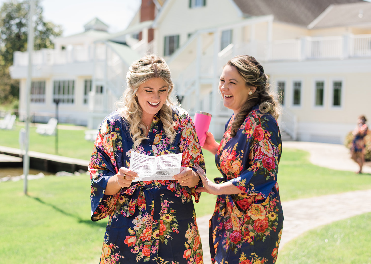 bridesmaids reading a letter and laughing