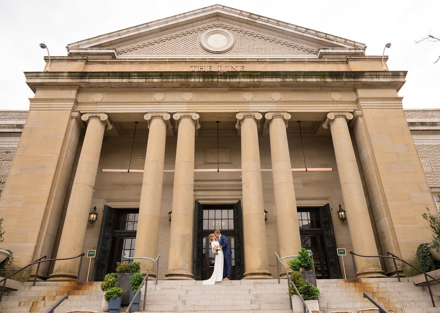 bride and groom stand in front of the line hotel in washington