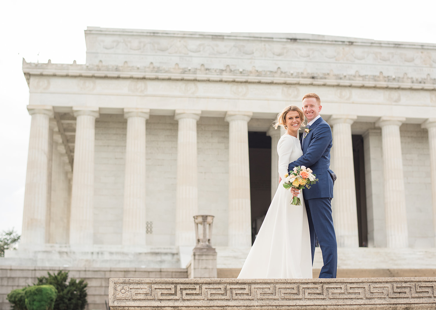 bride and groom in front of the Lincoln memorial