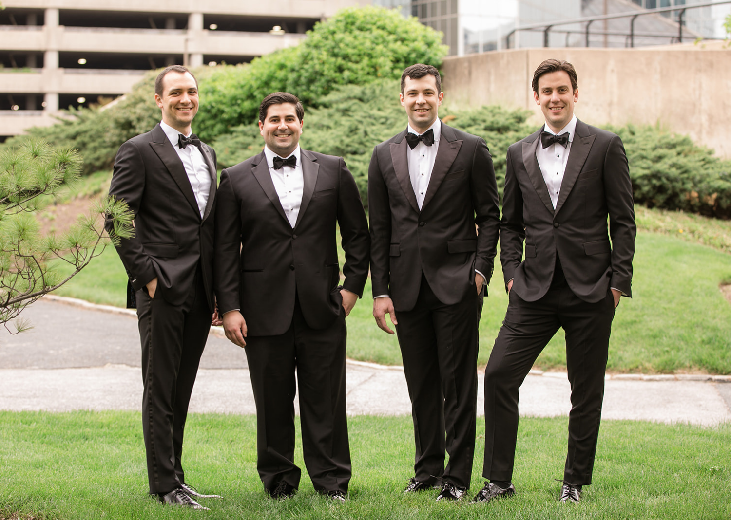 groomsmen smiling with the groom