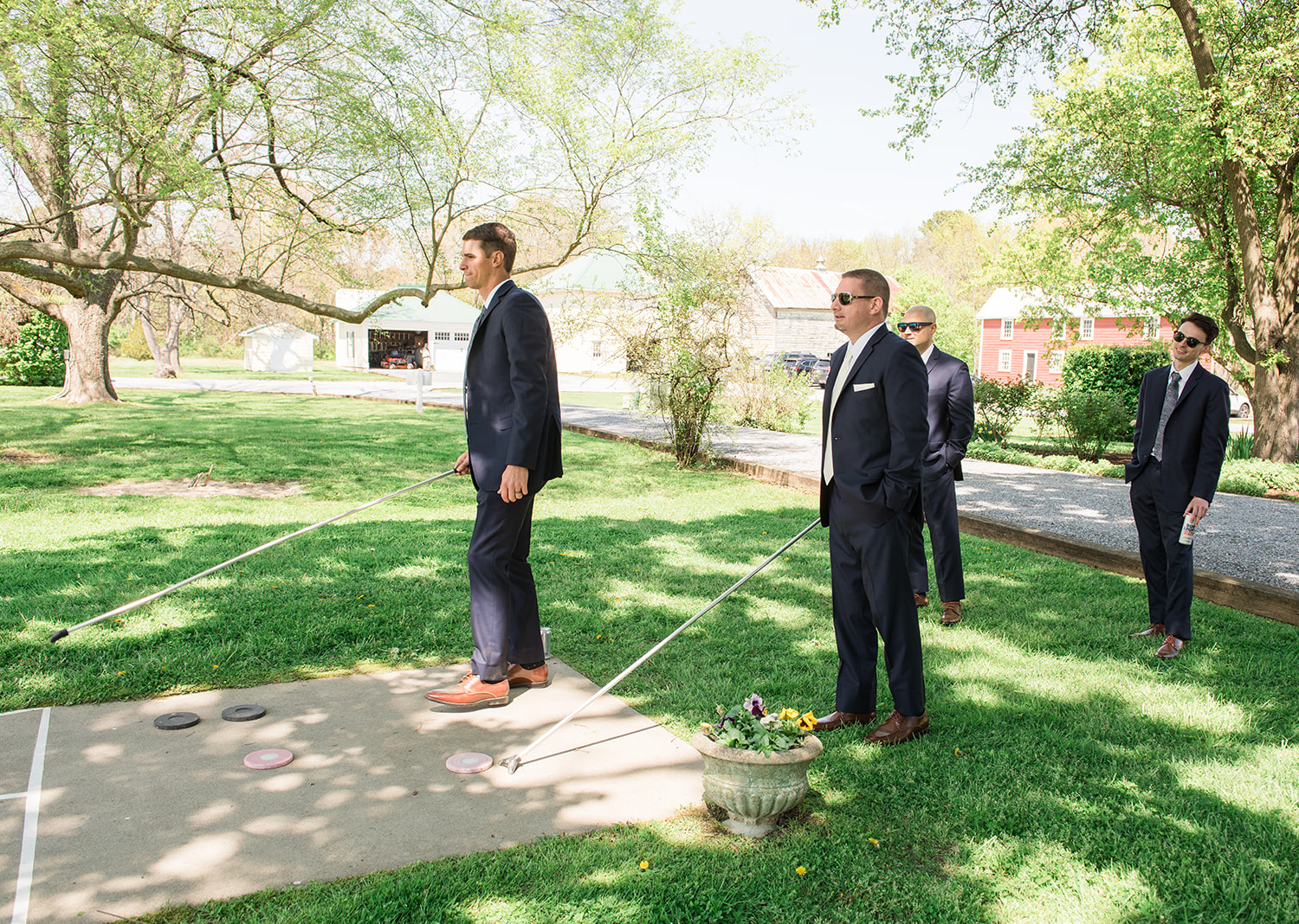 groomsmen playing outside before the wedding