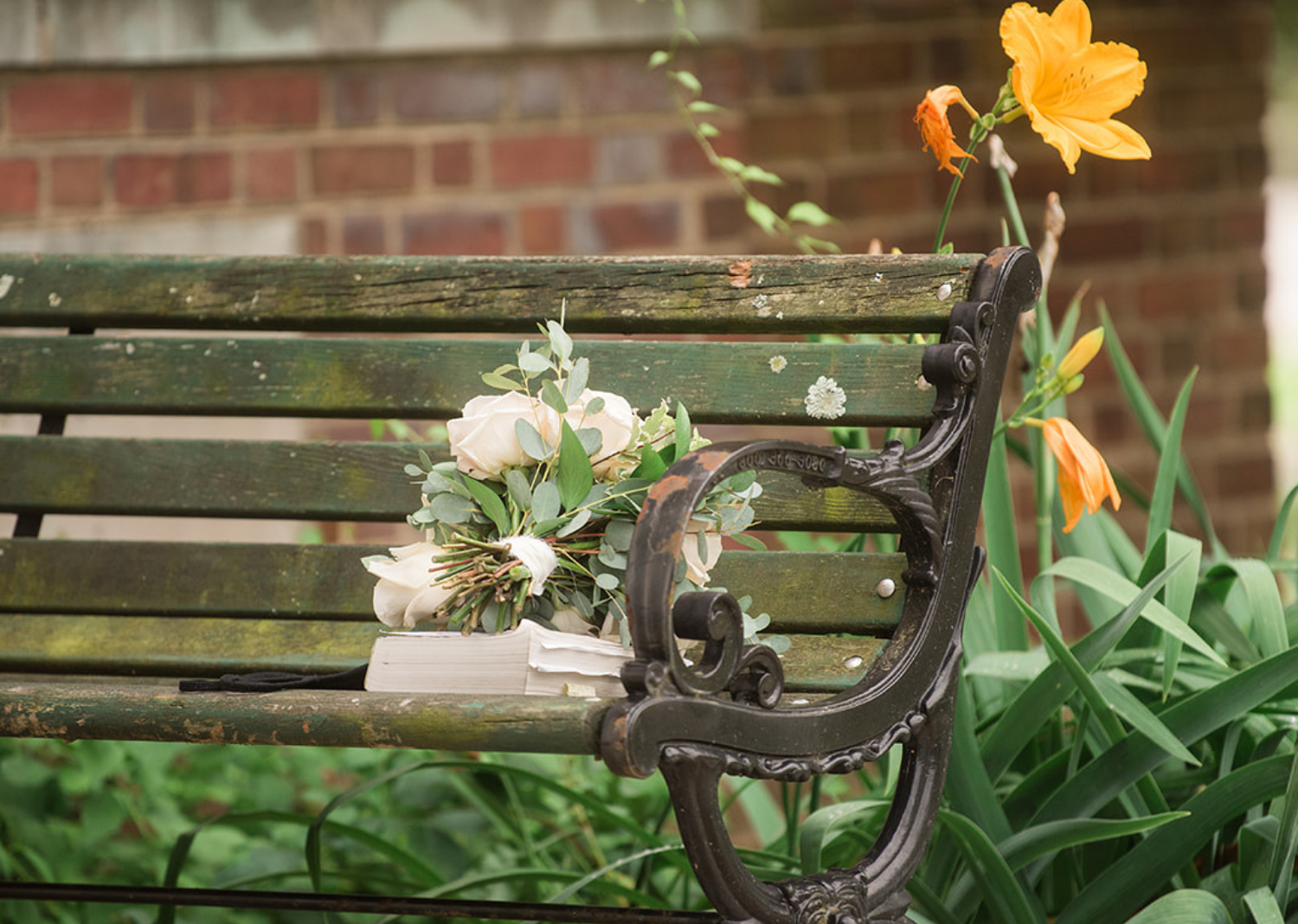 wedding bouquet on a park bench 