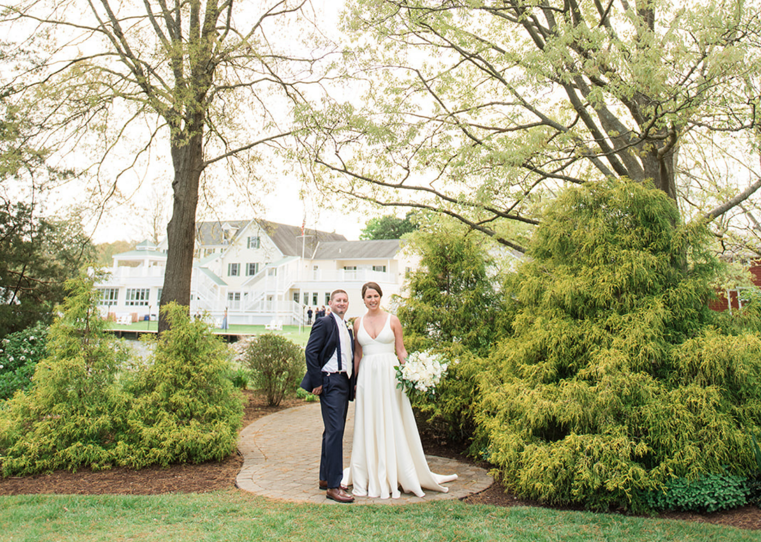 bride and groom smiling in the middle of the park