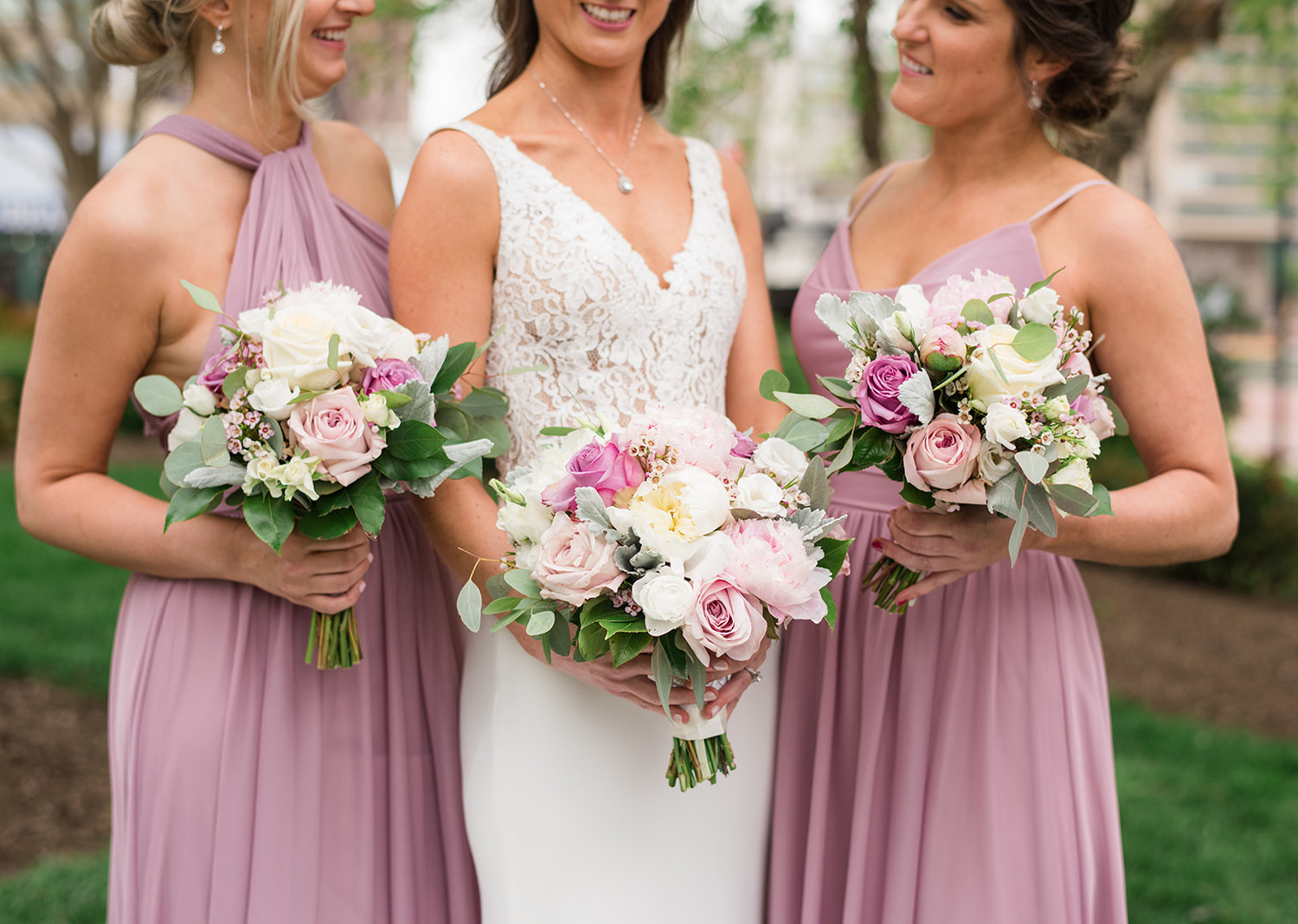 a close up shot of the bride and bridesmaids wedding day bouquets