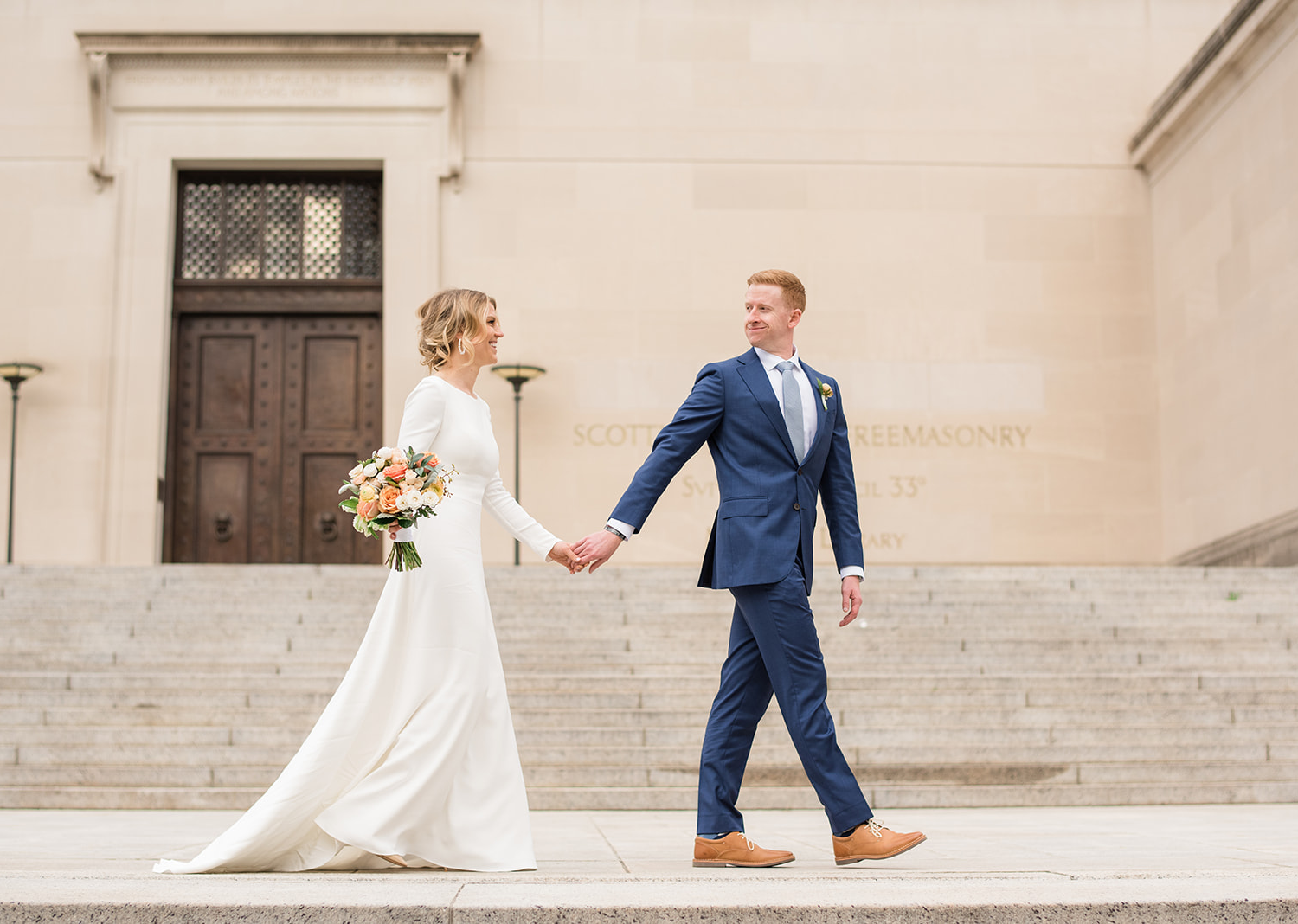 bride and groom take a stroll in the national mall in Washington D.C