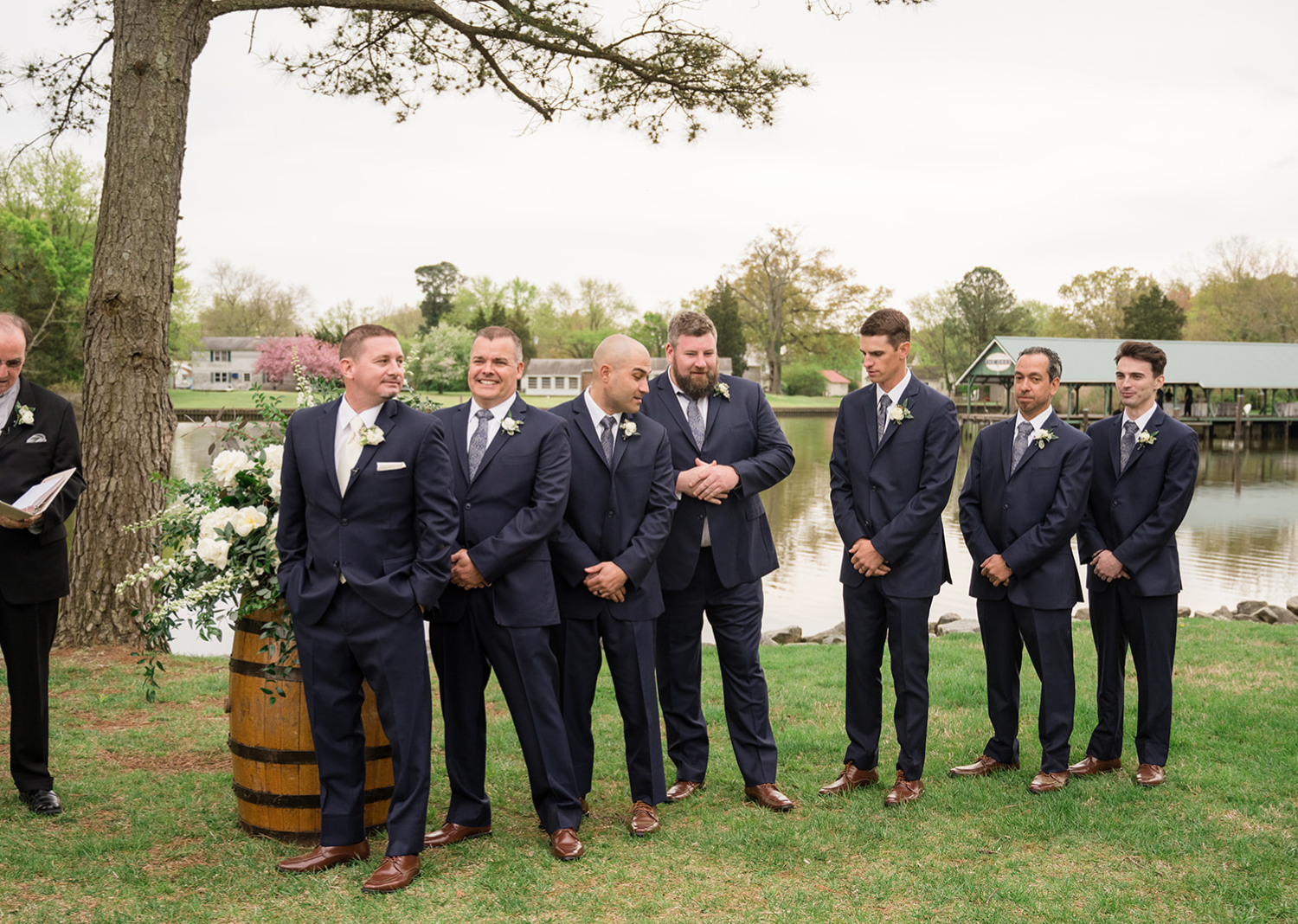 groom and groomsmen stand waiting for the bride during their wedding ceremony