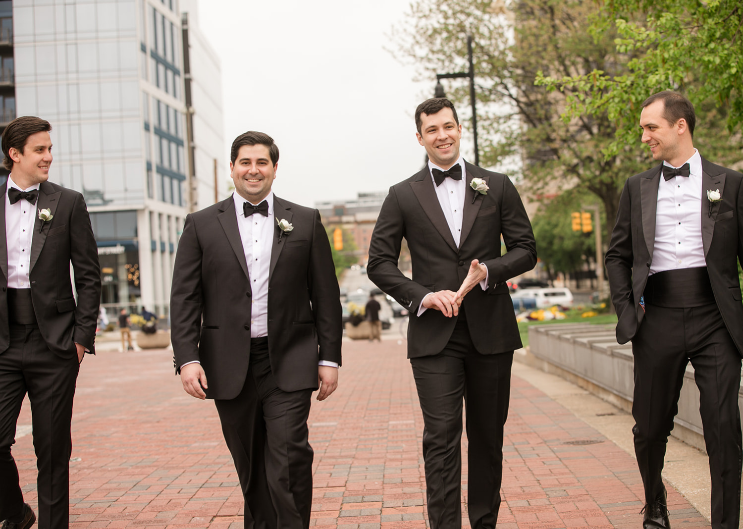 groom taking a stroll with his groomsmen