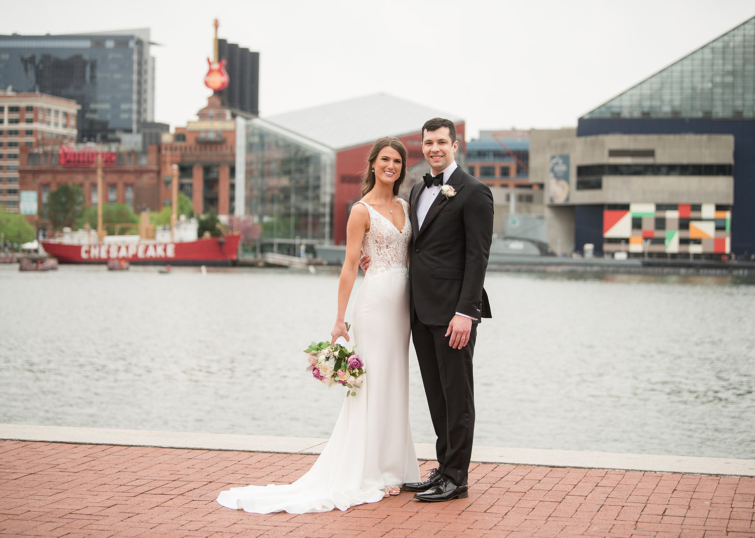 bride and groom wedding day portraits in front of a lake