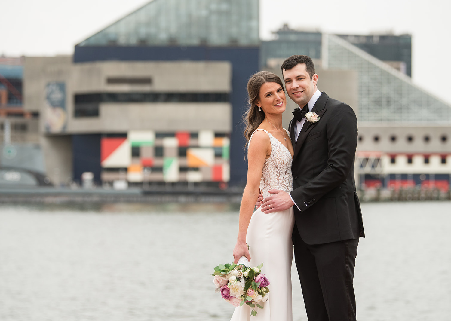 bride and groom wedding day portraits in front of a lake